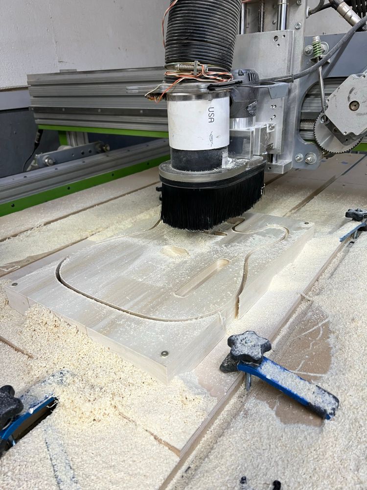 CNC milling machine finished cutting guitar