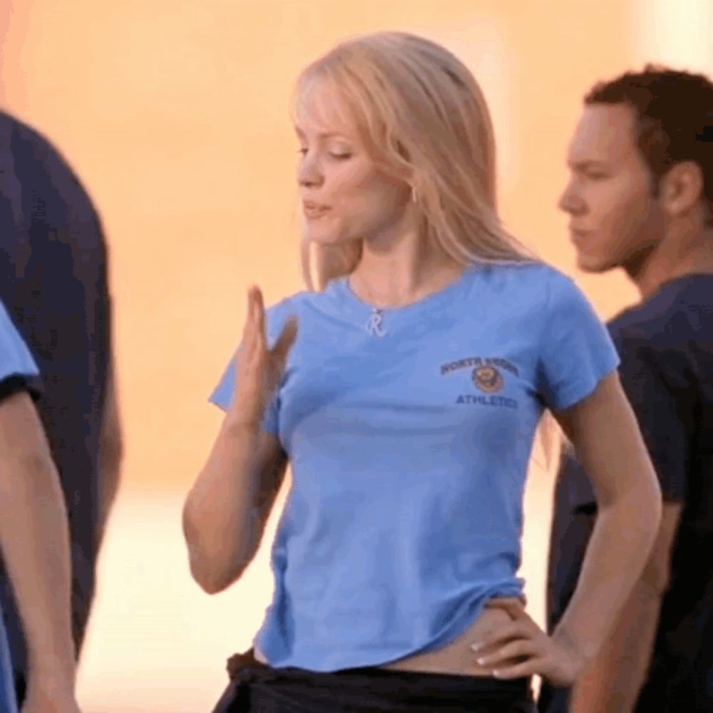 a woman wearing a blue shirt that says north point athletics on it