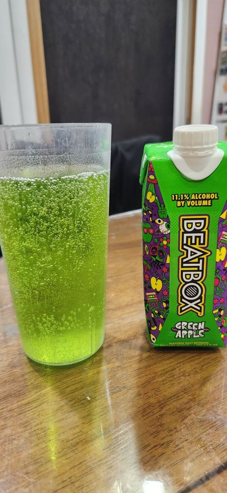 green apple beatbox wine drink mixed with gingerale looking neon green