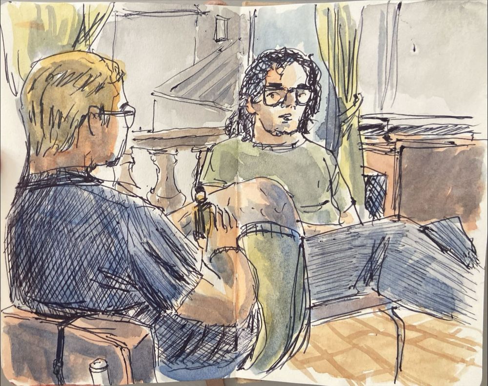 A loose sketch with ballpoint pen and watercolor of two guys talking together, sitting in a living room