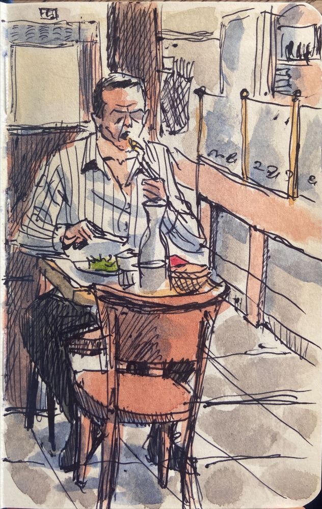 A sketch of a man eating in a restaurant