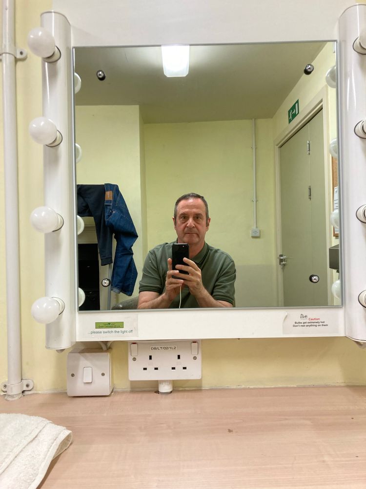 Pic of mark in dressing room mirror self photographing. 