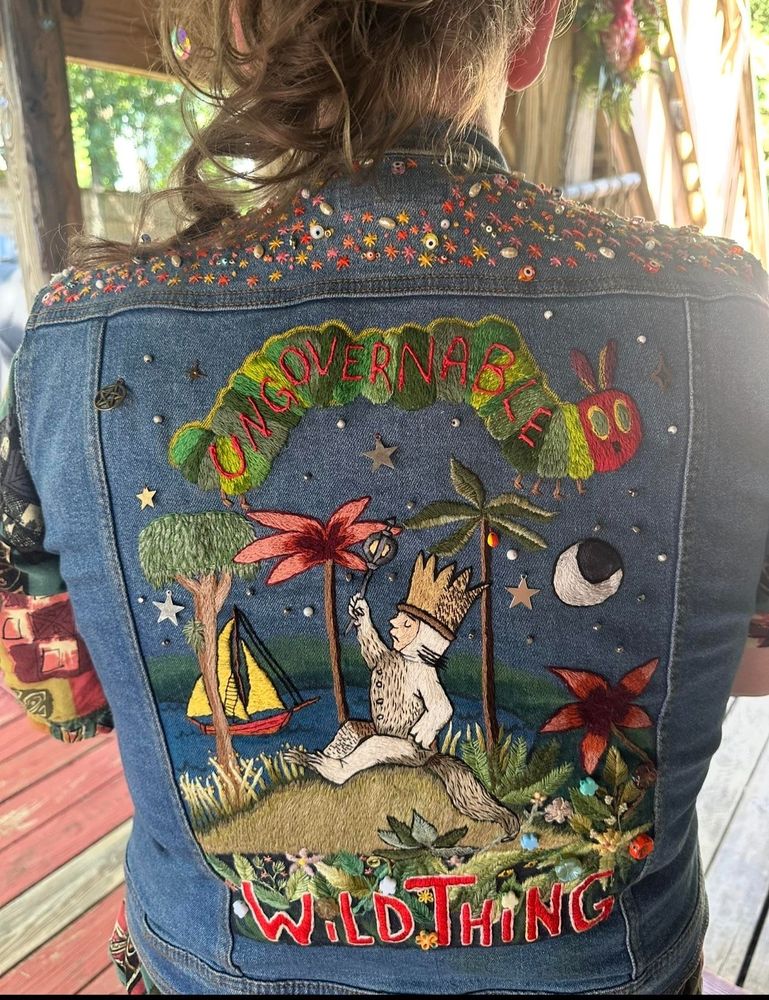 Where the wild things are on a back vest with ungovernable on it 