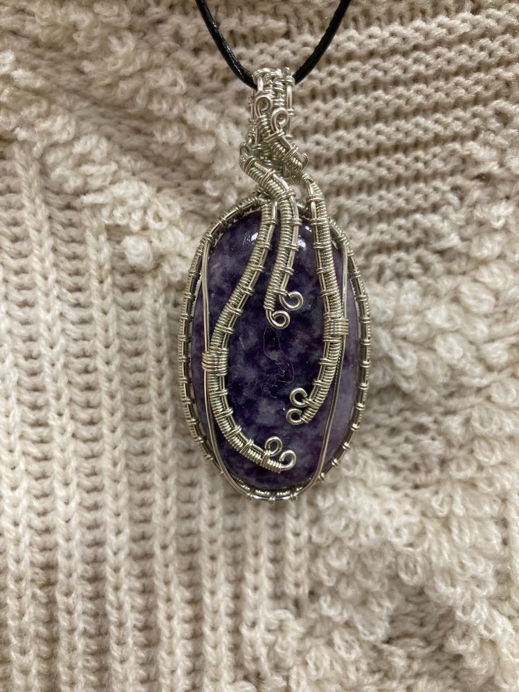 Freaking gorgeous wire-wrapped purple stone pendant. 