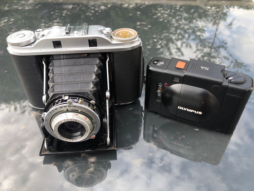 An Agfa Isolette III and an Olympus XA