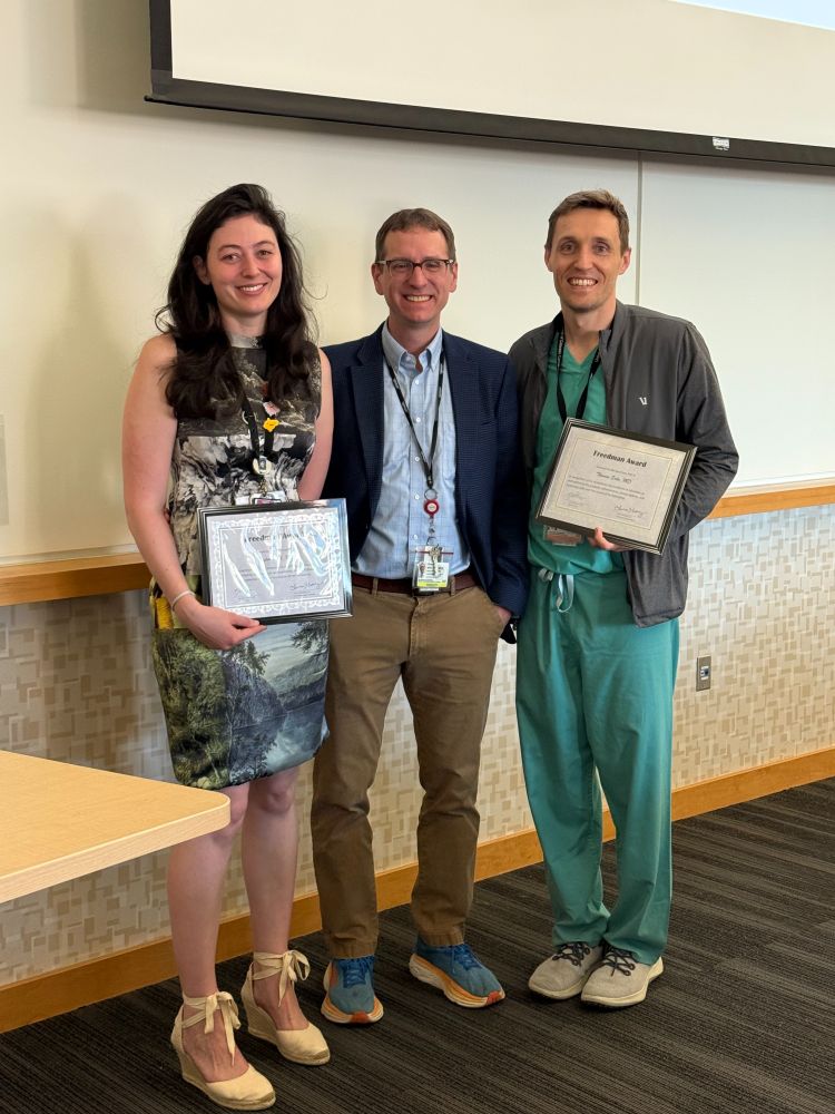 Taylor Karl, MD and Thomas Enke, MD are presented with the Dr. Marshall Freedman award by Dr. Frank Scott.