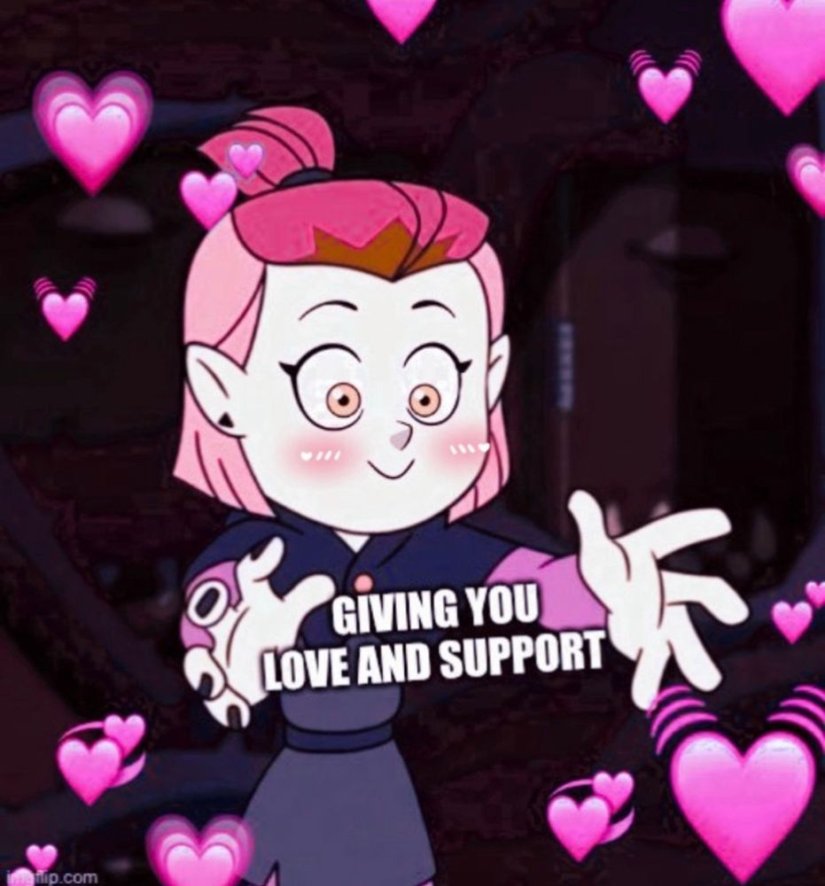 Meme of Amity Blight with her hands out stretched and a small smile on her face. There’s a pink filter over the image and pink emoji hearts around it and text in between amity’s hands that read: GIVING YOU LOVE AND SUPPORT