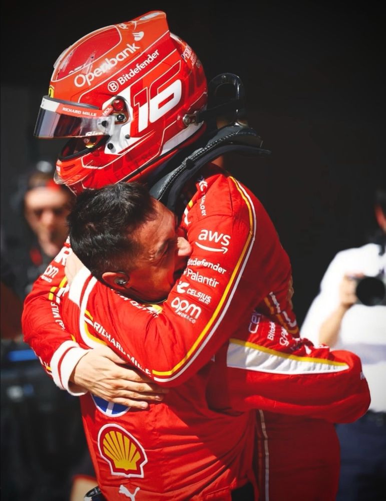 Ale picking up Charles in a hug