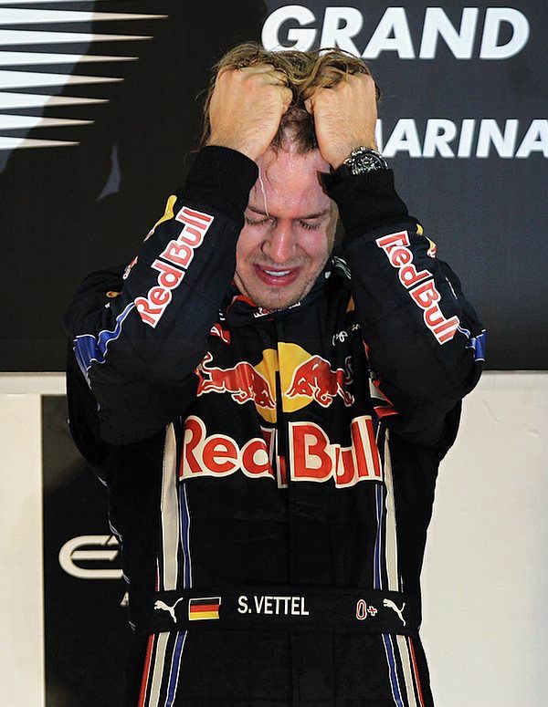 Sebastian Vettel emotional on the podium after winning the WDC 