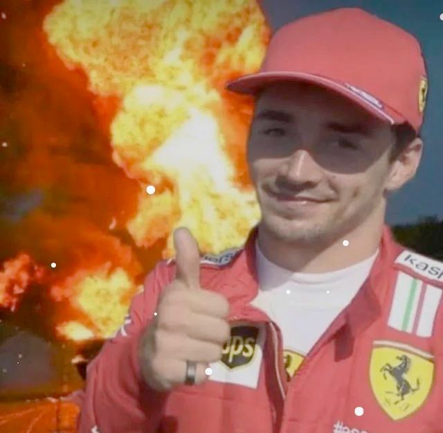 charles leclerc smiling and giving a thumbs up with an explosion edited into the background