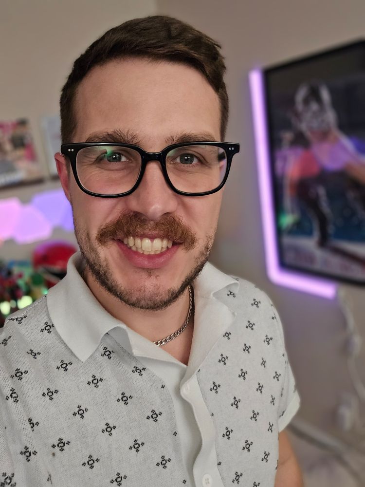 Josgat in a white short sleeve button up.