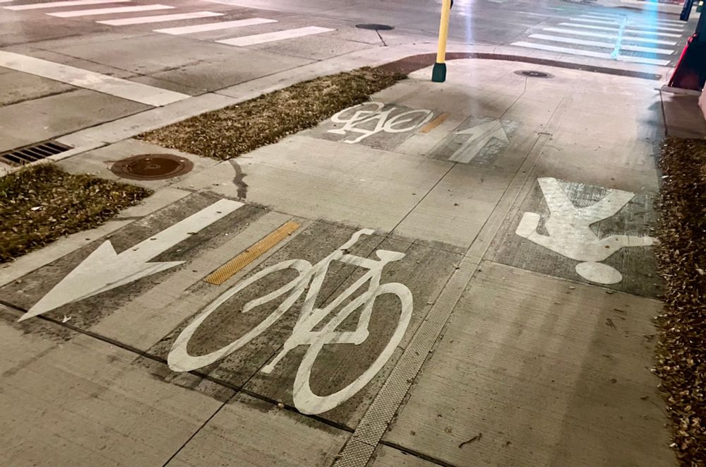 bicycle and pedestrian lanes marked on a new wide sidewalk
pavement on Main Street NE between East Hennepin Avenue and First Avenue NE in Minneapolis. 