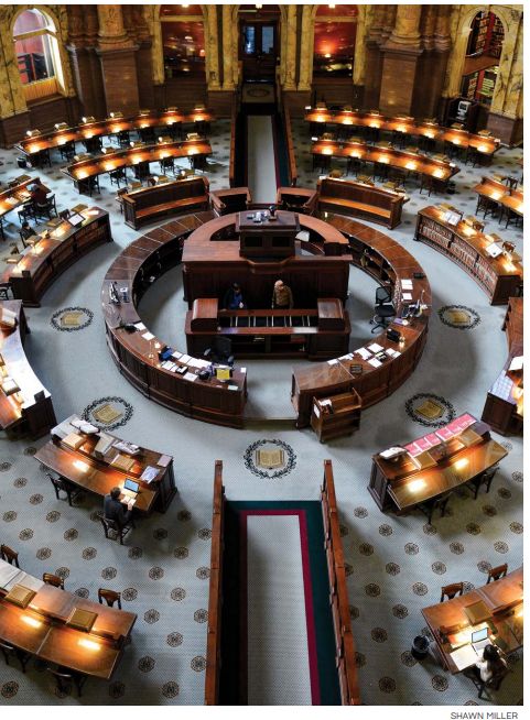 THE GREAT
CIRCULAR DESK
In 1888, Ainsworth Rand Spofford, the
sixth Librarian of Congress, detailed his
vision for the public reading room in the
new Congressional Library — now known
as the Thomas Jefferson Building. The
space should follow the example set by the
British Museum Library and be “circular or
octagonal in form, so that all parts of it may
be commanded” from the center.
To realize this “panopticon” concept,
Spofford provided specifications for a
“massive circular desk” that would give
librarians and the Main Reading Room
superintendent a view of every researcher,
the card catalog and each alcove
representing a major realm of knowledge.
Meanwhile, from the eye of the room’s
domed ceiling, the figures in the aptly
named painting “Human Understanding”
could monitor the books springing forth
from conveyor systems that connected
the control room under the central desk to
the stacks, the Capitol and eventually the
John Adams Building and beyond. In her
memoir “Thirty Years in Washington” (1901),
Mary Cunningham Logan, the widow of Sen.
John A. Logan, called the entire process —
identifying, requesting and delivering books
— a “marvel of ingenuity.”
