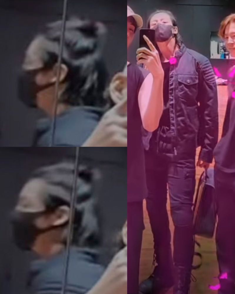 jungkook in a half ponytail and padded motorcycle pants and jacket