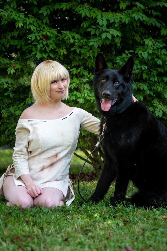 Fey as Fiona with Xander, a large black German Shepherd 