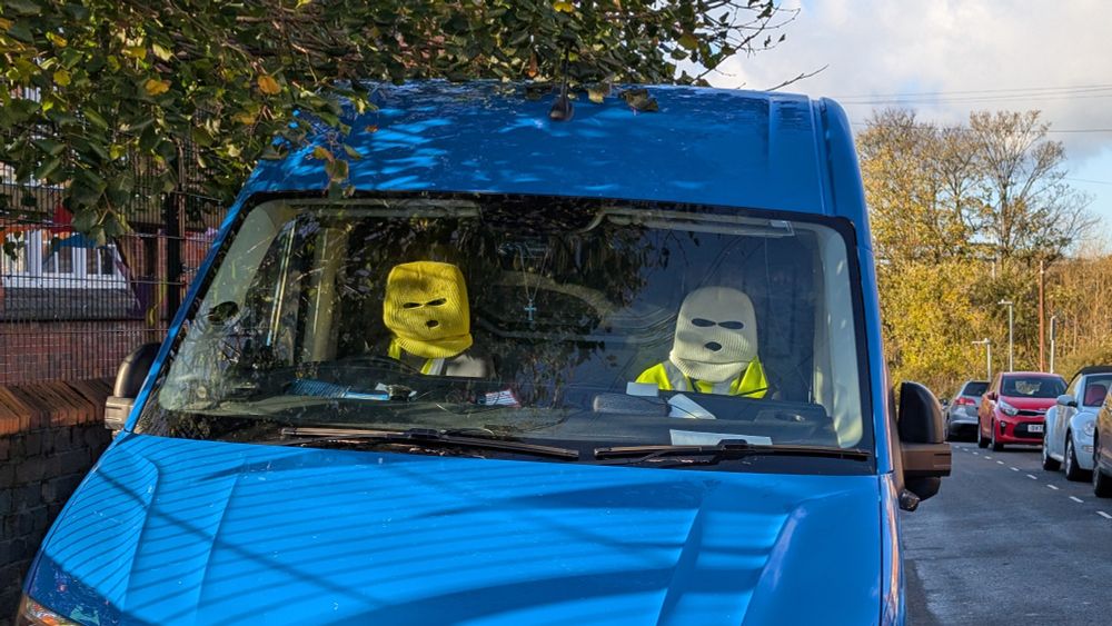 A van that has had its two seat heads wearing balaclava. 