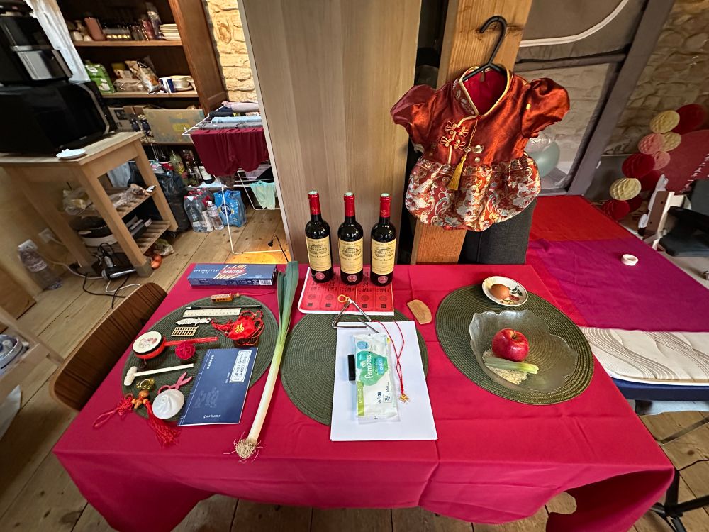 Items laid out on table for Chinese “Zhuazhou” 1st birthday ceremony 