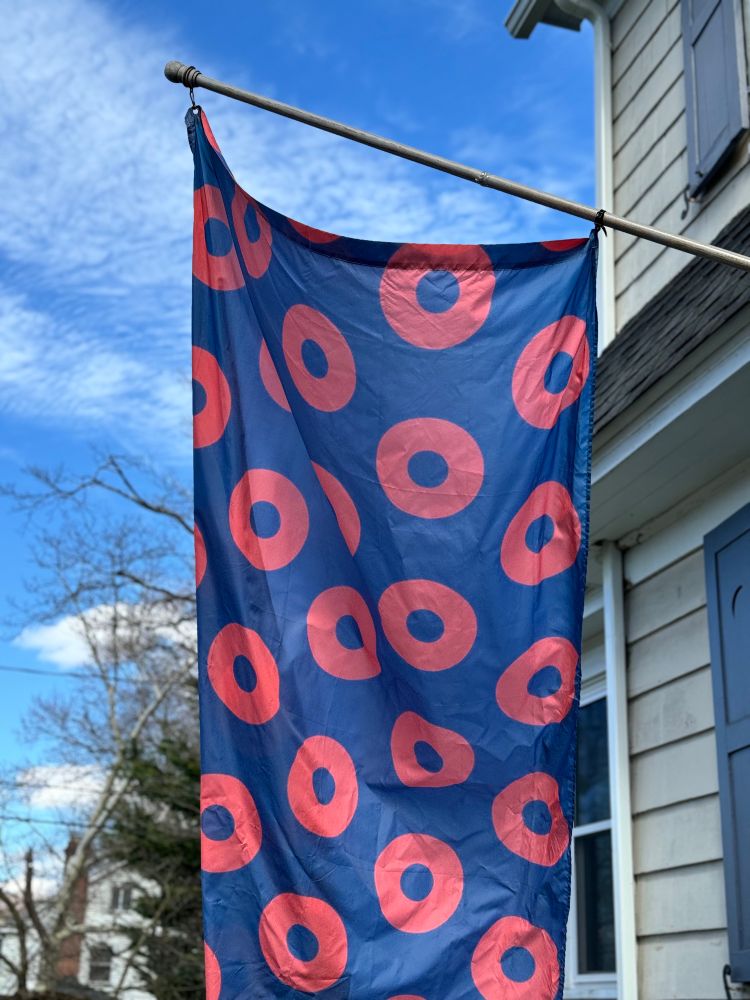 Phish donut flag hanging from a pole
