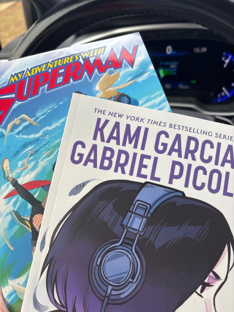 trade paperback editions of the "my adventures with superman" and "teen titans: raven" comic books