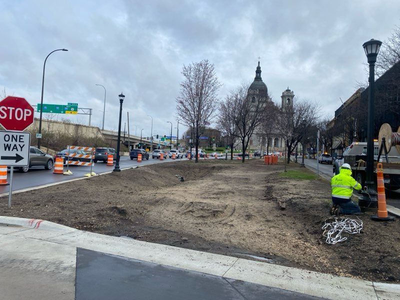 A photo of the "Before" condition of the Hennepin-Loring connection, with the dirt smoothed but no concrete poured and no GSI planted.