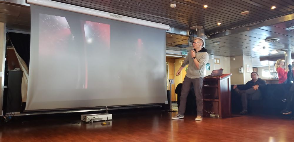 Thom Linley gives a lecture in the lounge aboard the Ocean Endeavour.