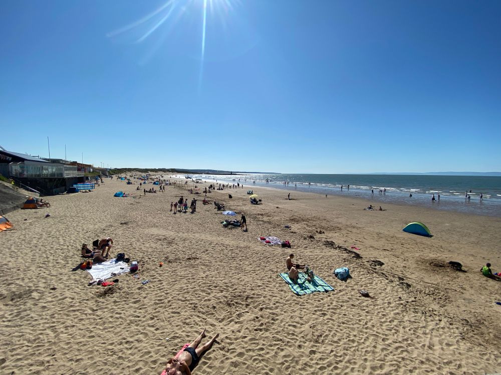 Coney Beach in Porthcawl, Glamorgan on a warm sunny morning is already busy.