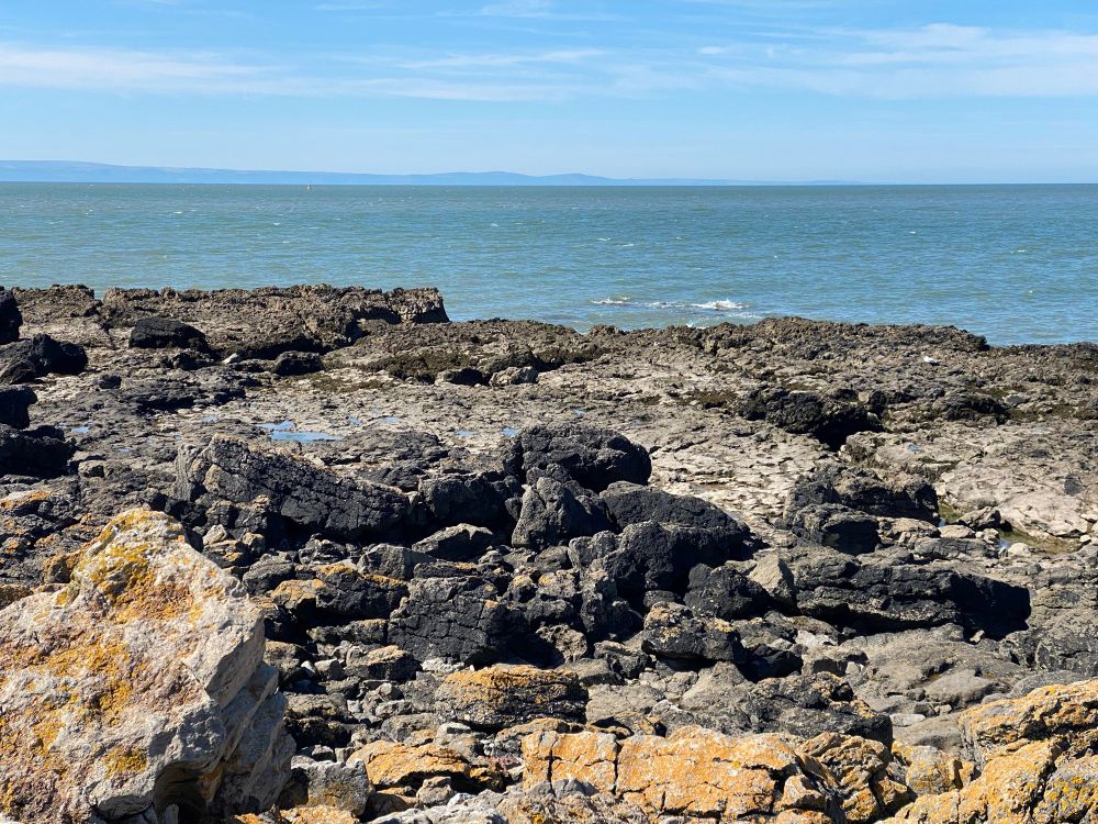 A rocky peninsula separates the two bays in Porthcawl, Glamorgan.