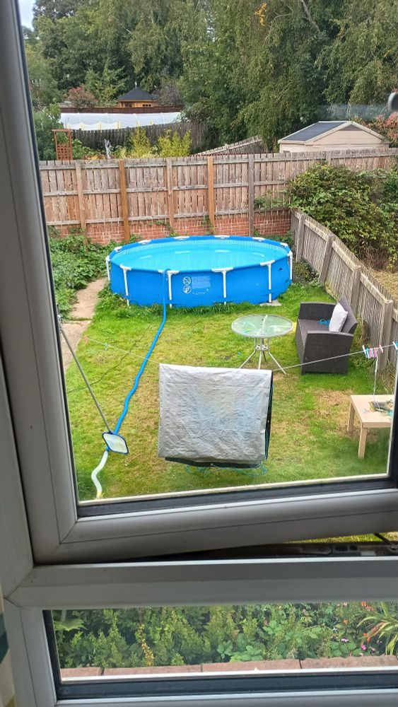 Garden pool in a garden being emptied at the end of summer 2025.