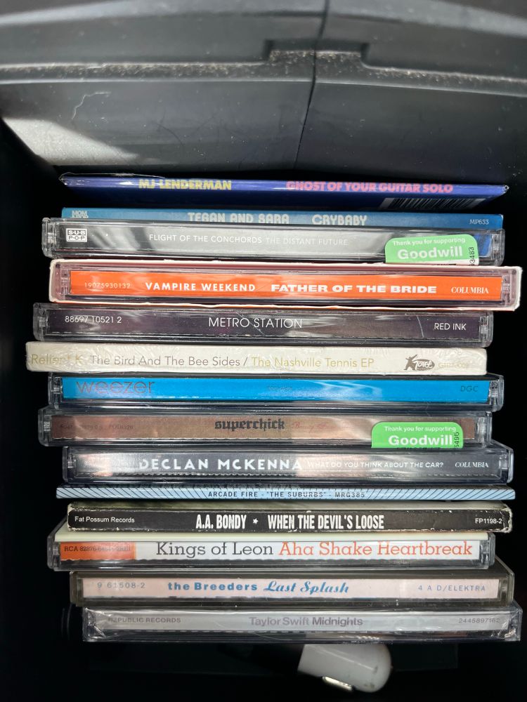 The CDs currently in the center console of my car 