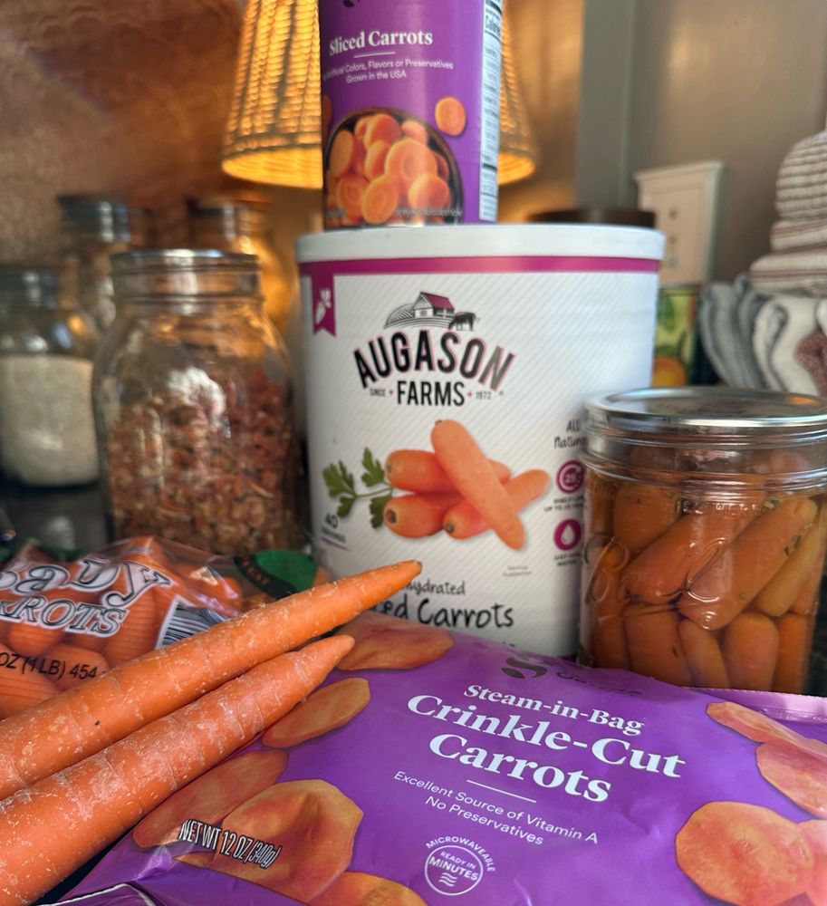 Carrots displayed in assorted states of preservation. Fresh, frozen, freeze dried, dehydrated and commercially as well as home canned. 