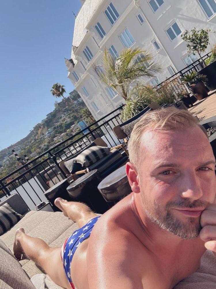 Matt sunbathing in a starts and stripes speedo