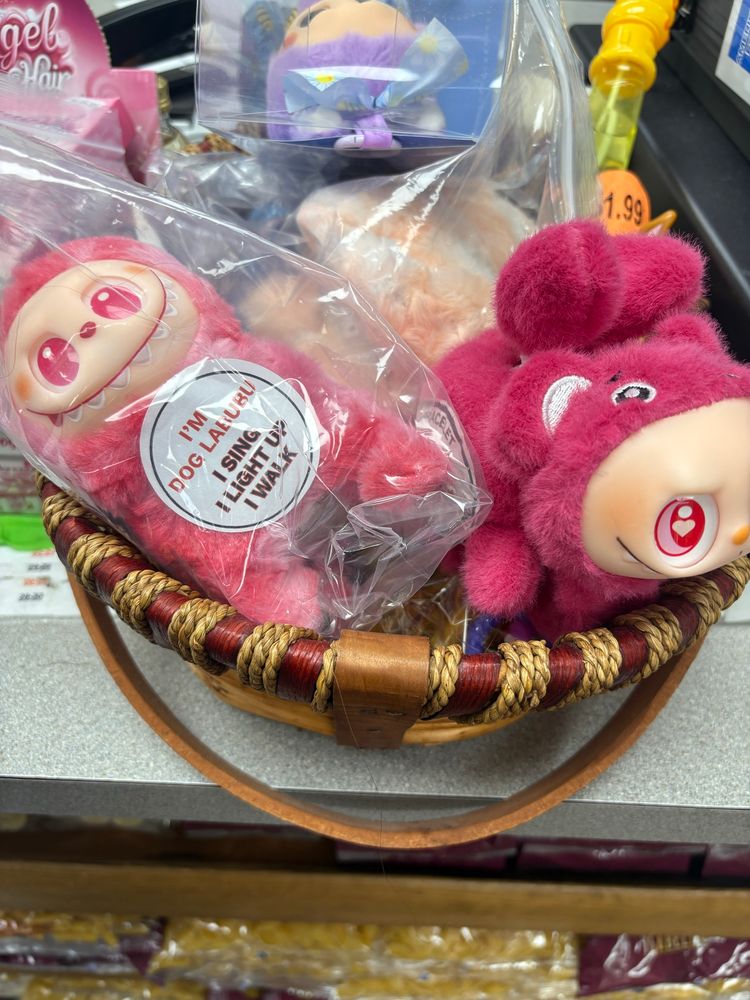 Creepy smiling Labubu dolls in hot pink