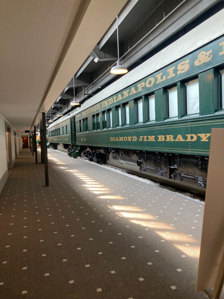 A hotel hall with a train facade