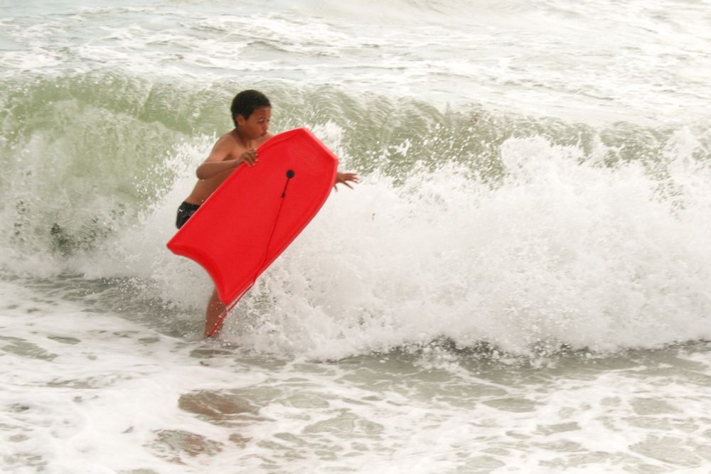 My son in the English Channel with bodyboard, November.