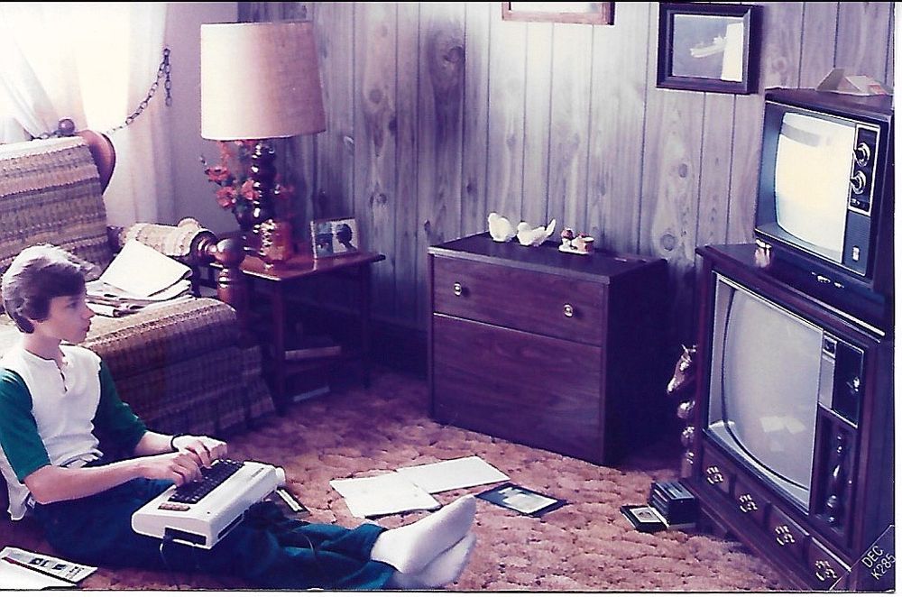 Kid typing in Commodore VIC-20. 