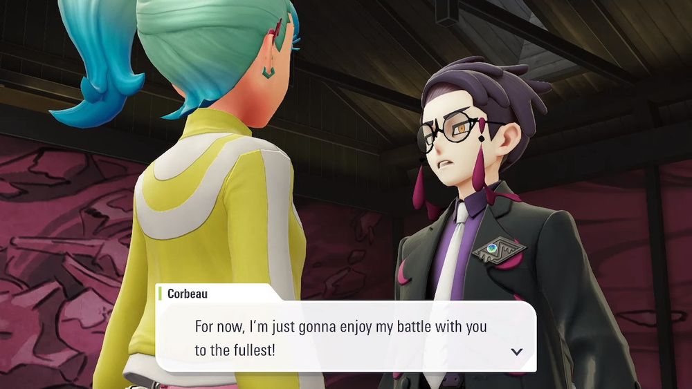 Screenshot from Pokemon Legends: Z-A, featuring Jess’ player character – a girl with pale skin and white hair with aqua tips wearing a brightly-colored outfit to match – seen from the back, standing facing Corbeau – a man with pale skin, dark purple hair, and orange eyes behind round, black-framed glasses and wearing a black suit with poison purple accents to match – as he speaks. His mouth is slightly open as he looks haughtily at her, and text on the screen reads: “For now, I’m just gonna enjoy my battle with you to the fullest!”
