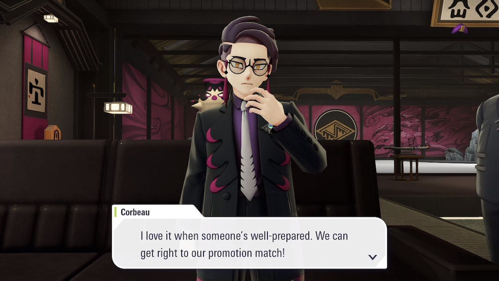 Screenshot from Pokemon Legends: Z-A, featuring Corbeau – a man with pale skin, dark purple hair, and orange eyes behind round, black-framed glasses and wearing a black suit with poison purple accents to match – standing in front of a Japanese-style screen and dark furniture as he faces the viewer. His hand is near his face after having pushed his glasses up his nose, and text on the screen reads: “I love it when someone’s well-prepared. We can get right to our promotion match!”