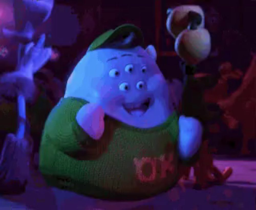 a cartoon character wearing a sweater that says ok on it