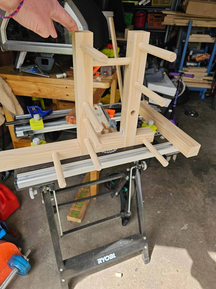 Upright assembled inkle loom with 4 bars on the front upright and 3 plus a rear bar  on the back.