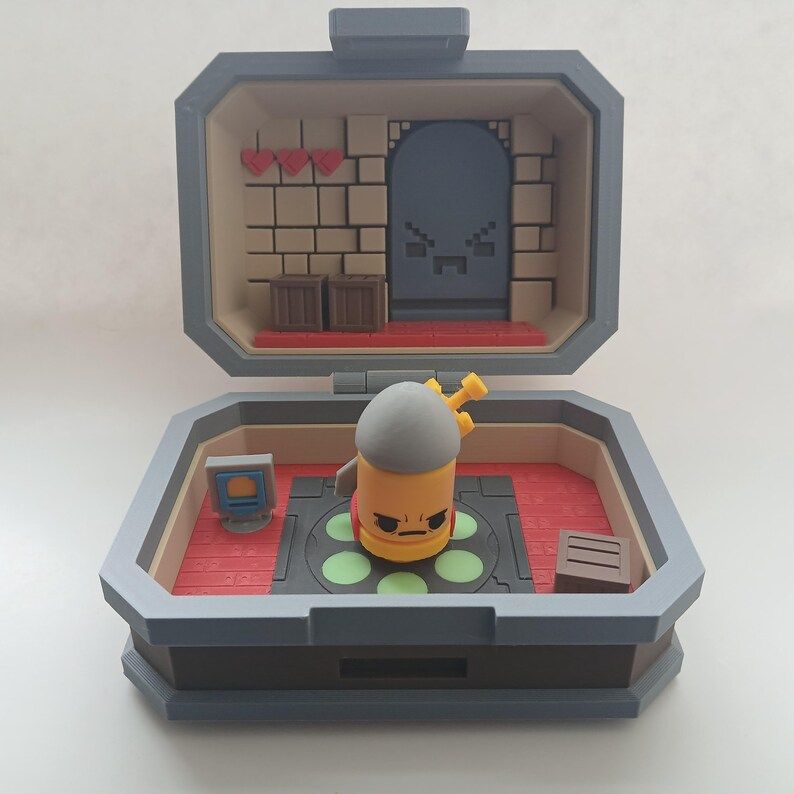 Enter the Gungeon pocket set diorama. It has The Bullet standing the center of a fast travel point (with glow in the dark circles) with an armor pick up and crate accessory.