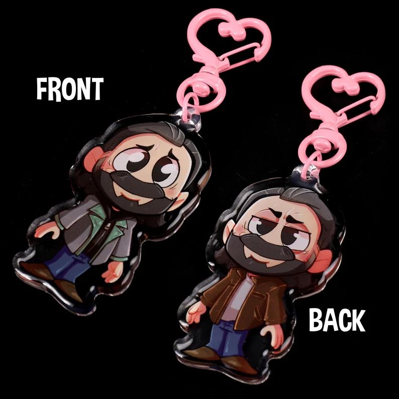 Alan Wake charm, front has him in his original outfit, back has him as Scratch