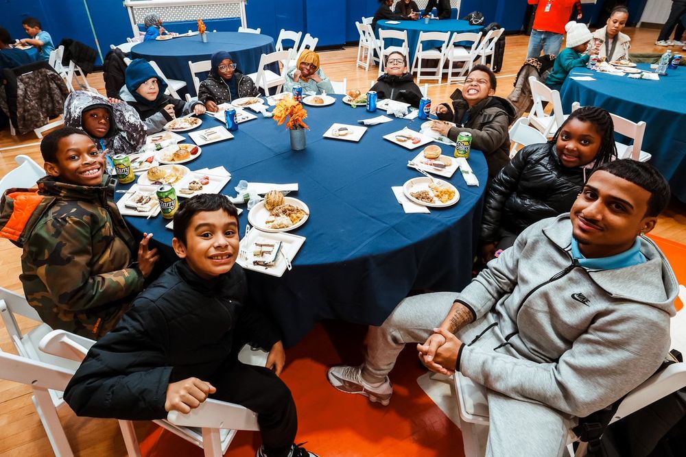 Local youth enjoy a Thanksgiving feast.