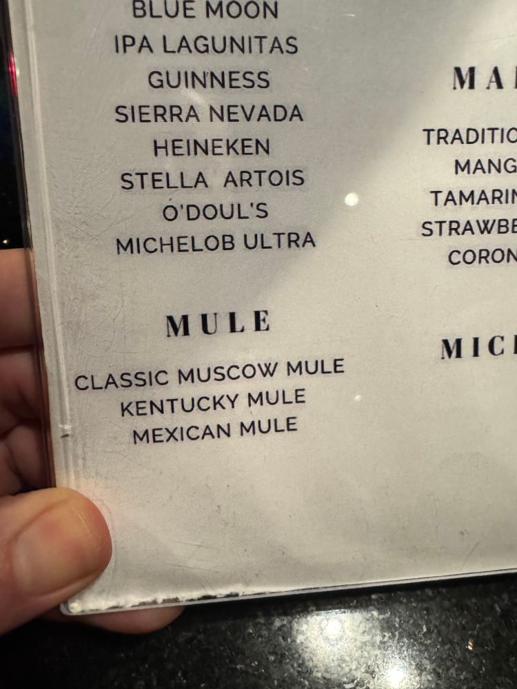 Bar menu with Moscow Mule misspelled. 