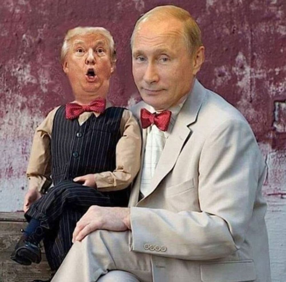 Trump portrayed as a ventriloquist dummy sitting on Putin’s lap.