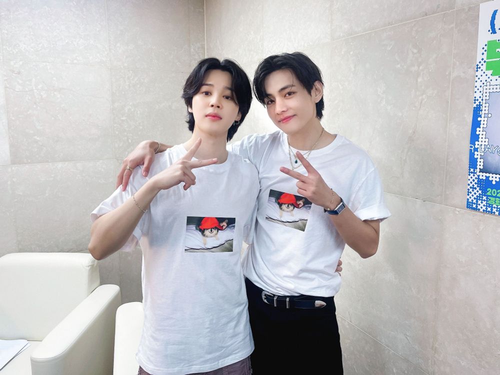 Jimin and Taehyung posing for the camera after a live event.