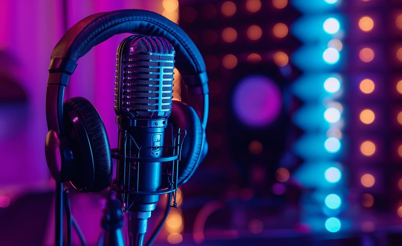 Radio microphone and headphones.