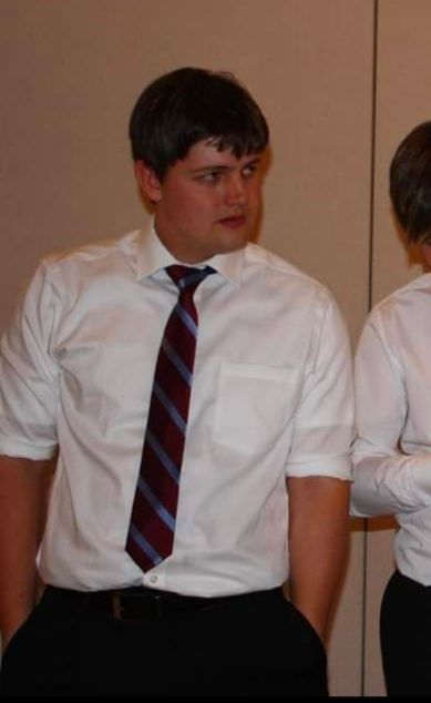 Emily at her dad's wedding in the middle of the kid's soeech