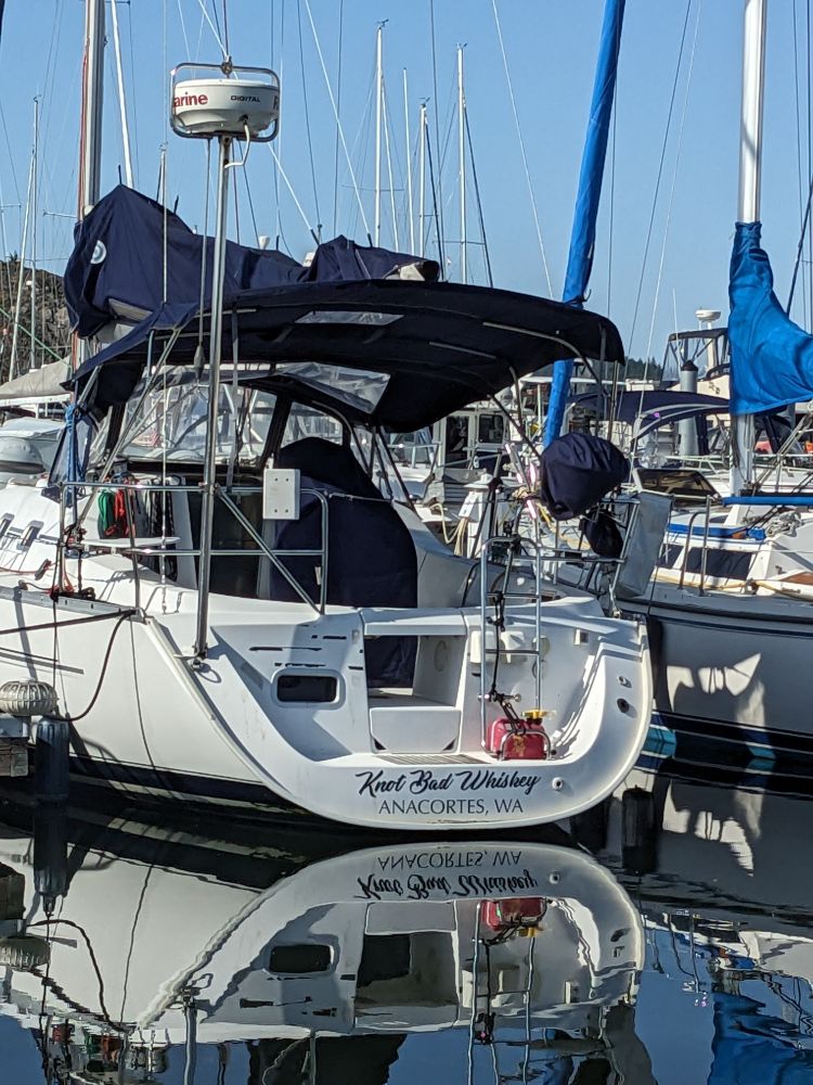 A sailboat named Knot Bad Whiskey at the dock