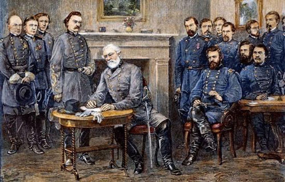Picture of Robert E. Lee with his fellow officers, Grant, and Union officers looking on, signing surrender papers on one of two tables in the room.