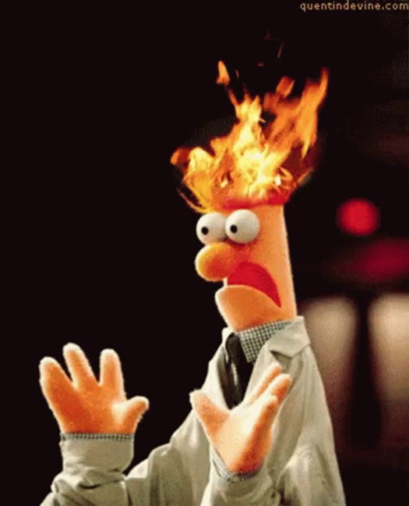 a puppet with flames coming out of his head and the website quentindevine.com